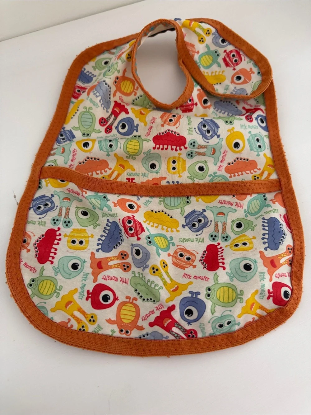 Kids Orange Trim Baby Bib with Colorful Monster Print